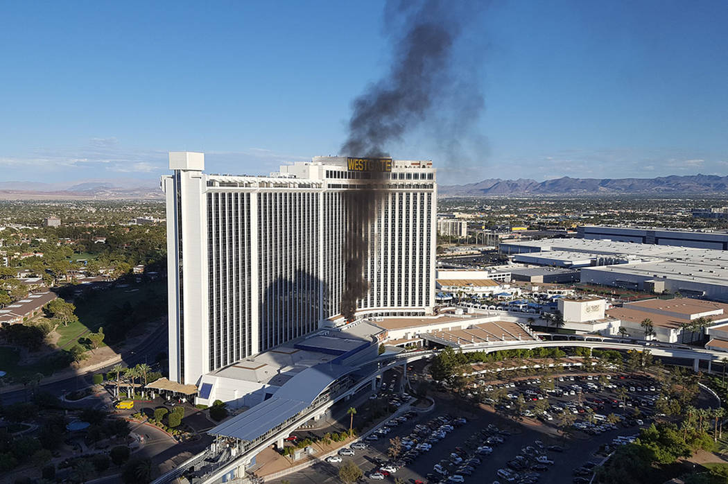 A fire burns outside a third-floor balcony at the Westgate at 3000 Paradise Road in Las Vegas on Saturday Aug. 26, 2017. James Fuhrman