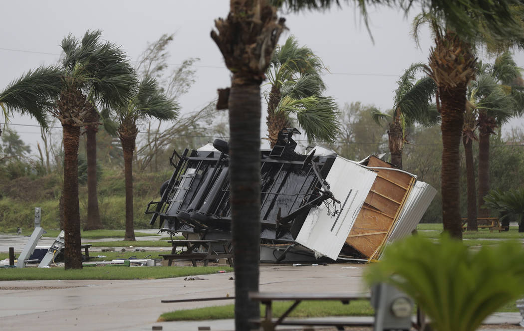 An overturned trailer sits in a park in the wake of Hurricane Harvey, Saturday, Aug. 26, 2017, in Aransas Pass, Texas. Harvey rolled over the Texas Gulf Coast on Saturday, smashing homes and bus ...