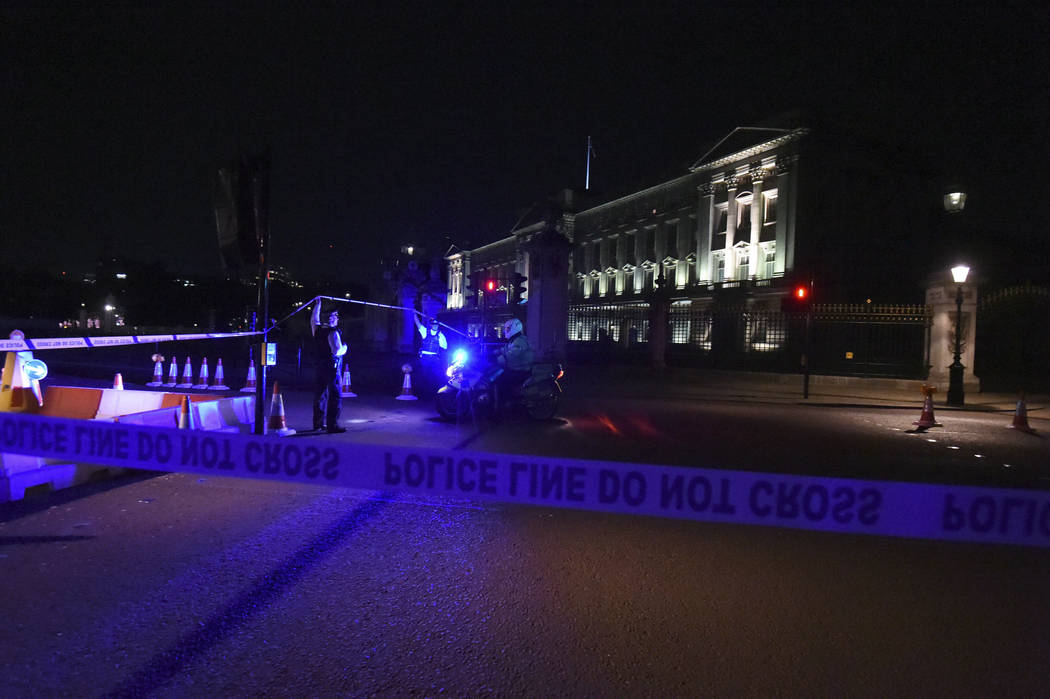 A police cordon outside Buckingham Palace where a man has been arrested after an incident, in London, Friday Aug. 25, 2017. A man armed with a knife was detained outside London’s Buckingham ...