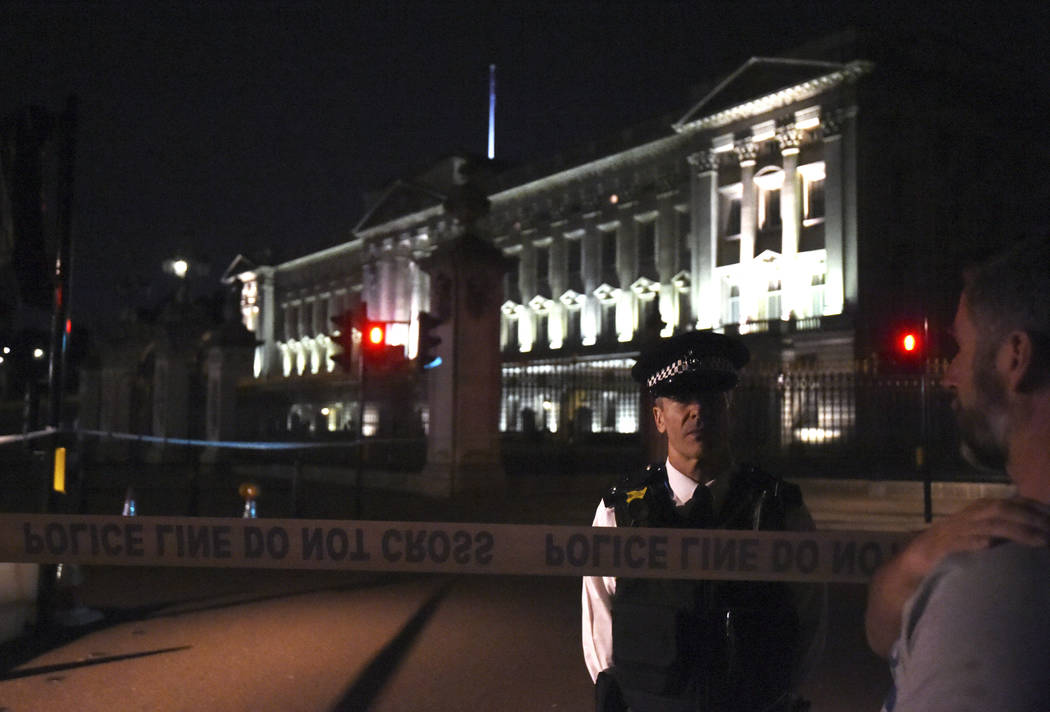 A police cordon outside Buckingham Palace where a man has been arrested after an incident, in London, Friday Aug. 25, 2017. A man armed with a knife was detained outside London’s Buckingha ...
