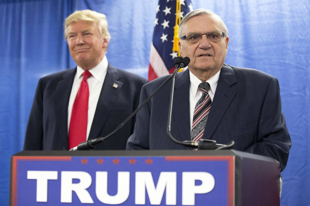 Republican presidential candidate Donald Trump, left, is joined by Maricopa County, Arizona, Sheriff Joe Arpaio during a new conference Jan. 26, 2016, in Marshalltown, Iowa. President Donald Trump ...