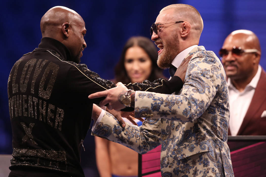 Floyd Mayweather, left, and Conor McGregor joke around at the post fight press conference on Saturday, Aug 26, 2017, at T-Mobile Arena, in Las Vegas. (Benjamin Hager/Las Vegas Review-Journal) @ben ...