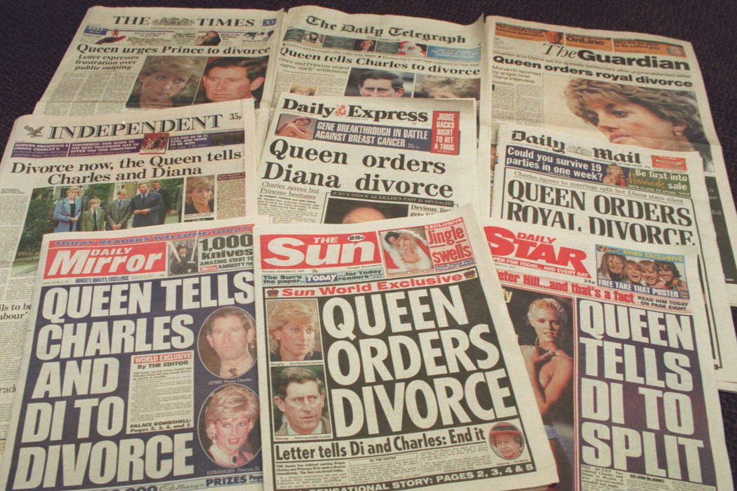 The London newspapers front page headlines are seen in December 1995. (AP Photo/Martin Cleaver, File)