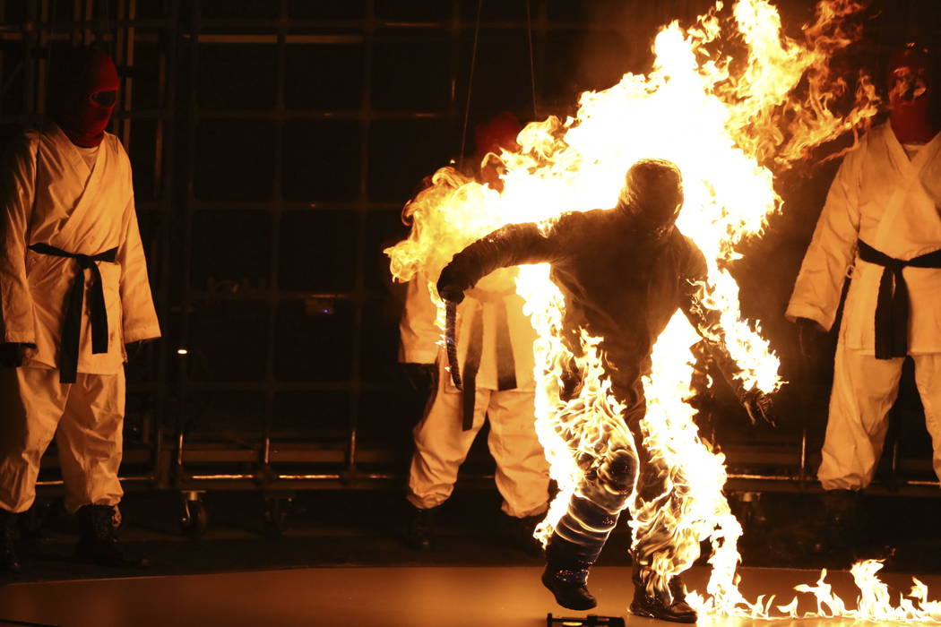 A dancer appears on stage on fire during a performance by Kendrick Lamar at the MTV Video Music Awards at The Forum on Sunday, Aug. 27, 2017, in Inglewood, Calif. (Photo by Matt Sayles/Invision/AP)