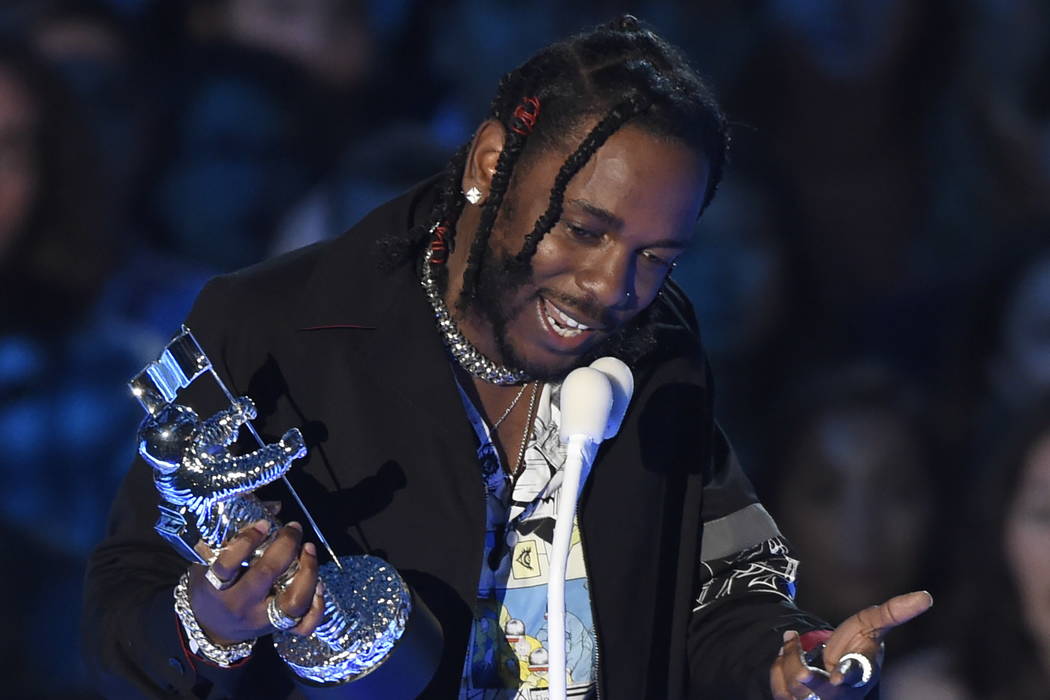 Kendrick Lamar accepts the award for video of the year for &quot;HUMBLE.&quot; at the MTV Video Music Awards at The Forum on Sunday, Aug. 27, 2017, in Inglewood, Calif. (Photo by Chris Piz ...
