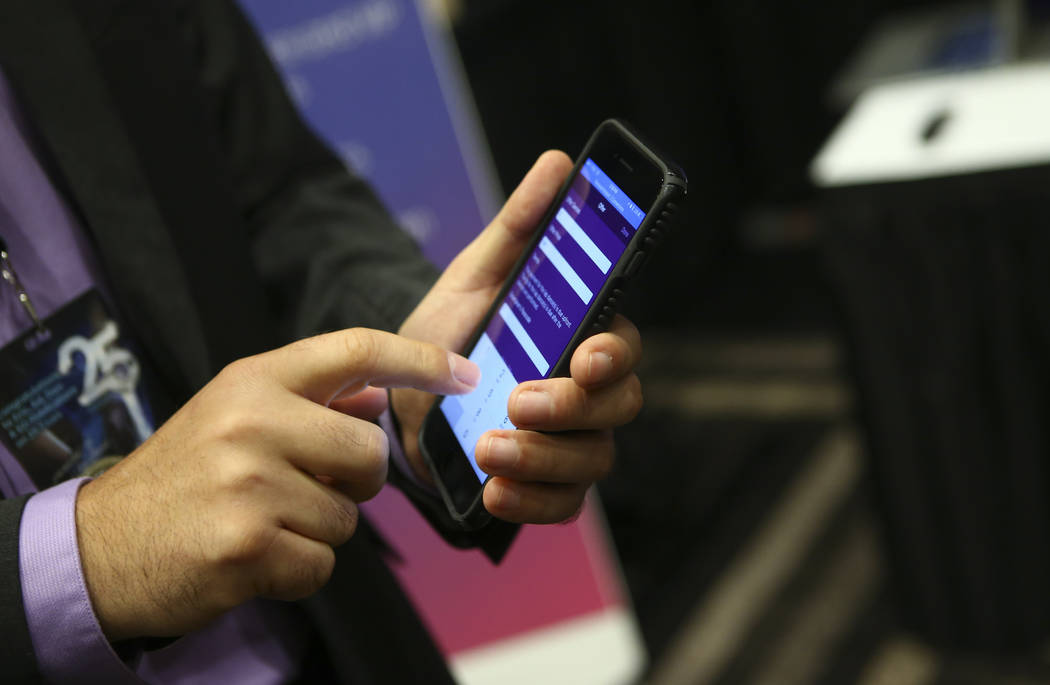 Radu Grama of Frolic shows off the company's app during the Gentlemen's Club Expo at Hard Rock Hotel in Las Vegas on Tuesday, Aug. 29, 2017. Chase Stevens Las Vegas Review-Journal @csstevensphoto