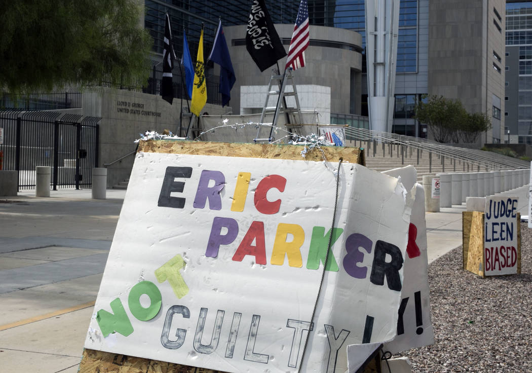 A not guilty sign bearing the name of Eric Parker, recently acquitted of most charges in the Bunkerville standoff, outside the Lloyd George U.S. Courthouse on Thursday, Aug. 31, 2017, in Las Vegas ...