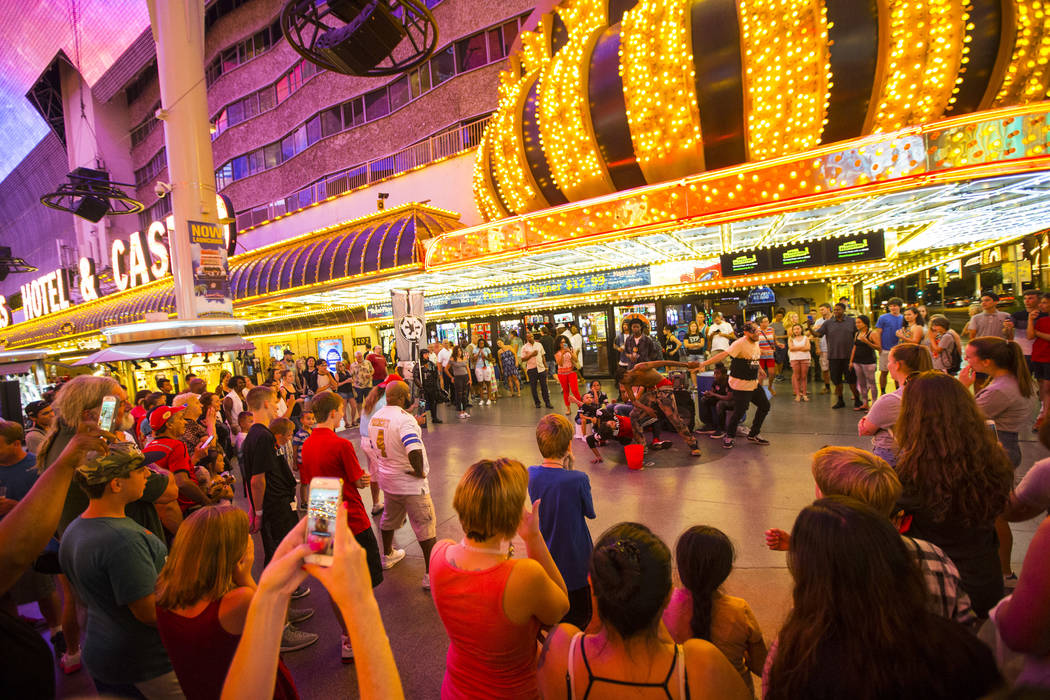 Bone-breaking buskers draw a crowd with their performance along the Fremont Street Experience in downtown Las Vegas on Thursday, Aug. 3, 2017. Chase Stevens Las Vegas Review-Journal @csstevensphoto