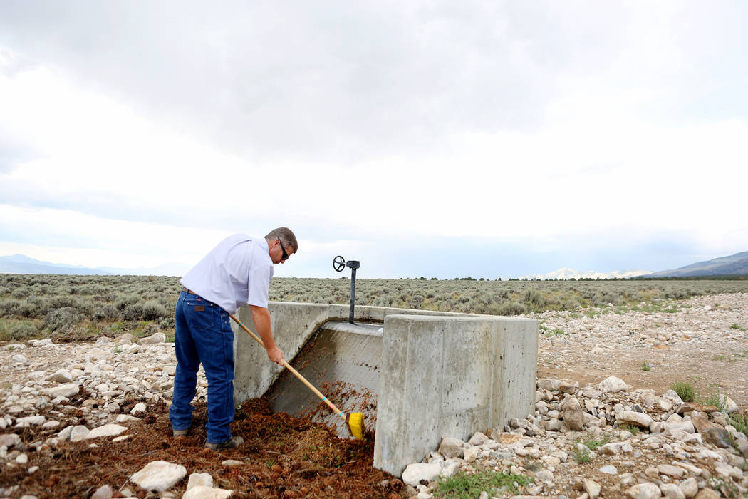 Ranch and resource manager Bernard Petersen cleans off the box screen that get debris out of an irrigation line at Great Basin Ranch in Spring Valley, Monday, Aug. 7, 2017. Elizabeth Brumley Las V ...