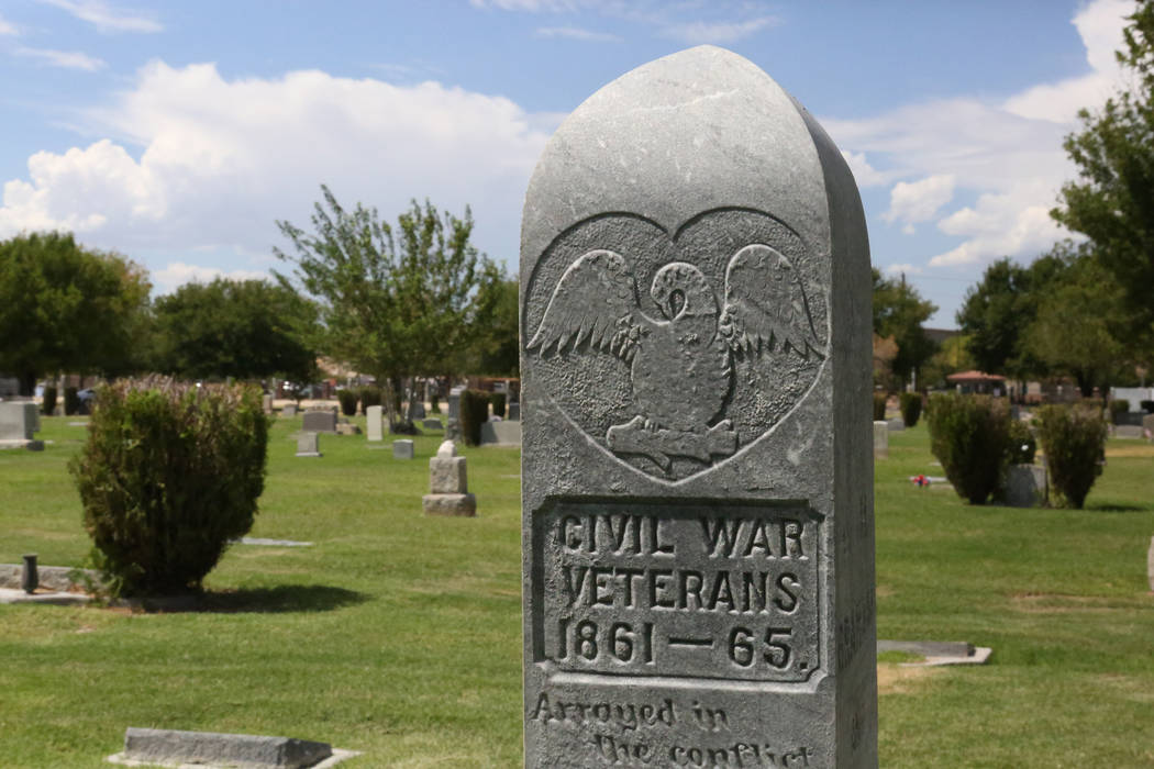 A granite pillar marks the grave site of two Civil War veterans, William Keith who wore blue and Joseph Graham who wore gray, at the Woodlawn Cemetery in Las Vegas on Tuesday, Aug. 29, 2017. (Mich ...