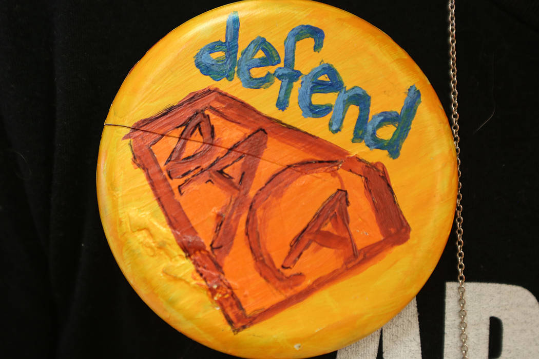 An attendee sports a button that says &quot;Defend DACA&quot; during an informative event on Deferred Action for Childhood Arrivals at East Las Vegas Community Center on Tuesday, Sept. 5,  ...