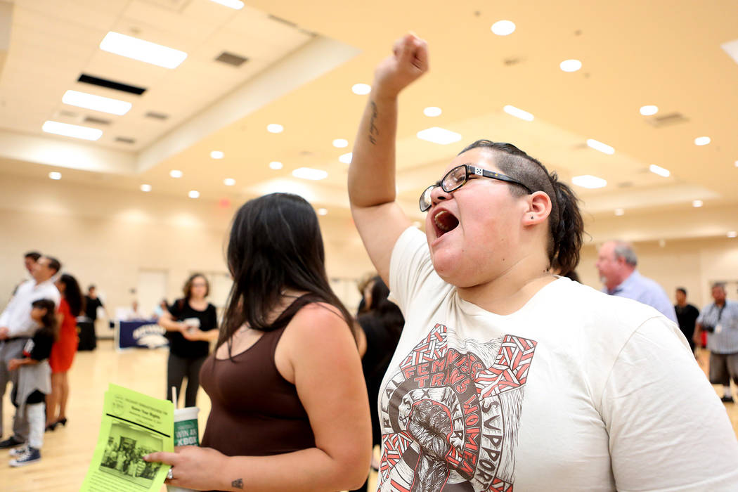 Attendee and activist Yesenia Moya chants &quot;S, se puede&quot; with the crowd during an informative event on Deferred Action for Childhood Arrivals at East Las Vegas Community Center on ...