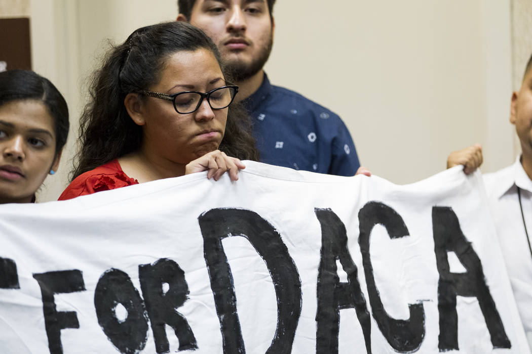 Katherine Lorenzo, from left, Kenia Morales, and Arturo Gonzales, supporters of the Deferred Action for Childhood Arrivals program, attend a press conference on the cancellation of DACA at the Eas ...