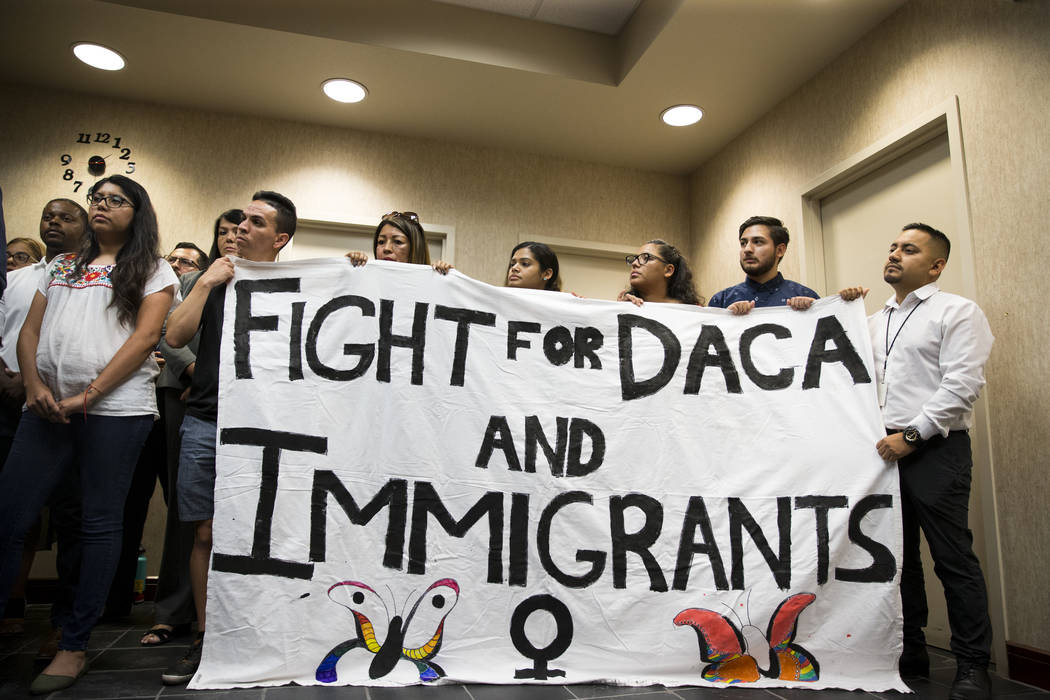 Supporters of the Deferred Action for Childhood Arrivals program attend a press conference on the cancellation of DACA at the East Las Vegas Community Center, in Las Vegas, Tuesday, Sept. 5, 2017. ...