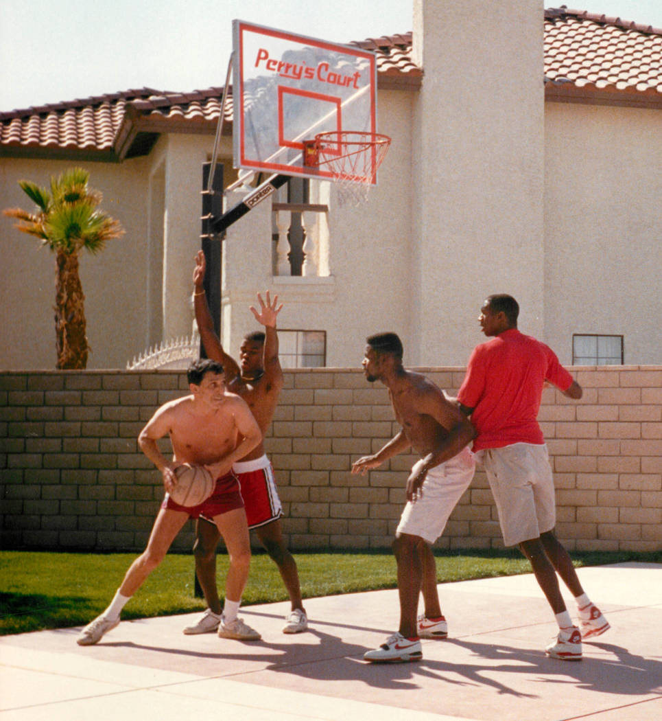 Richard Ҕhe Fixer" Perry, left, with UNLV players, from second from left, Anderson Hunt, Moses Scurry and David Butler in a photograph that was published in the Las Vegas Review-Journal May 26, 1 ...