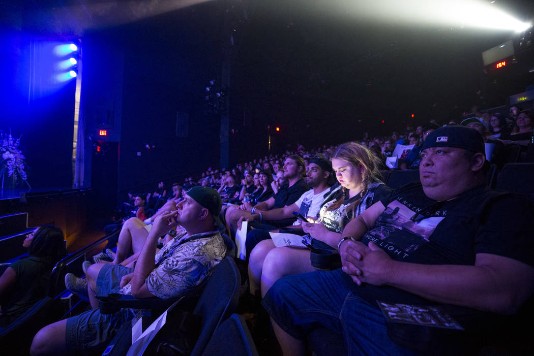 Linkin Park fans listen to Dead by Sunrise guitarist Ryan Shuck during a memorial for the singer and songwriter Chester Bennington at Saxe Theater on Saturday, Sept. 2, 2017, in Las Vegas. Shuck a ...