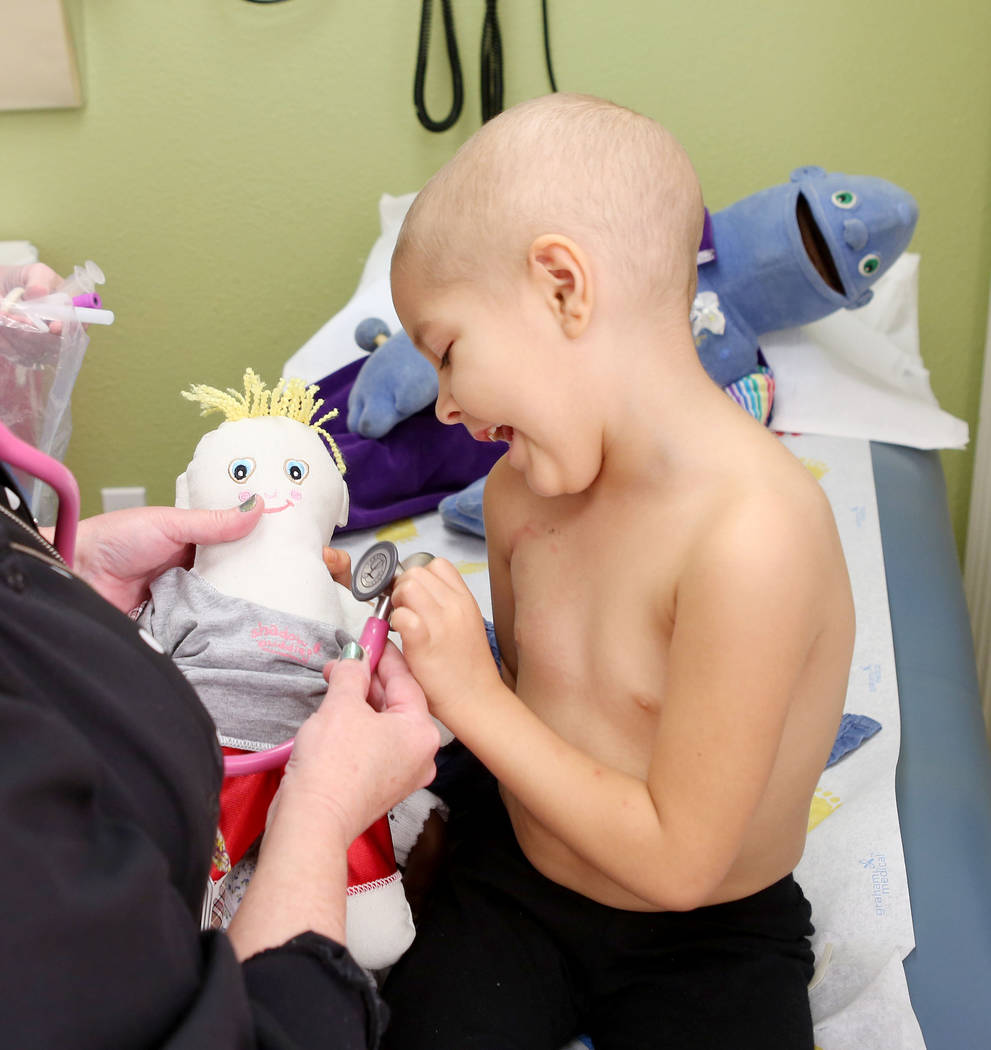 Leukemia patient Madilyn Cash, 4, checks her shadow buddy's heart rate at the Children's Specialty Center of Nevada in Las Vegas, Tuesday, Sept. 5, 2017. Shadow buddies are used to help patients c ...