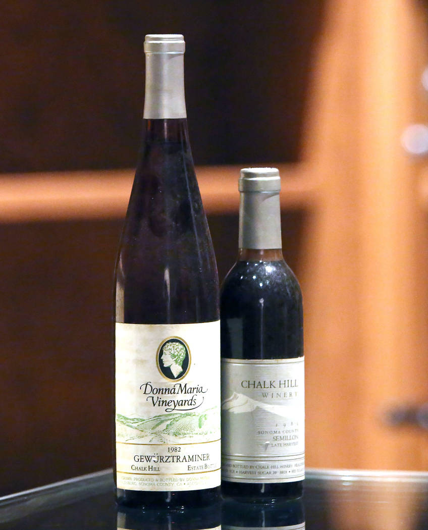 A 1982 Gewürztraminer bottle wine, left, and a 1984 Semillion wine are displayed at Chalk Hill Estate Vineyards' underground wine cellar, owned by the Vegas Golden Knights owner Bill Foley, i ...