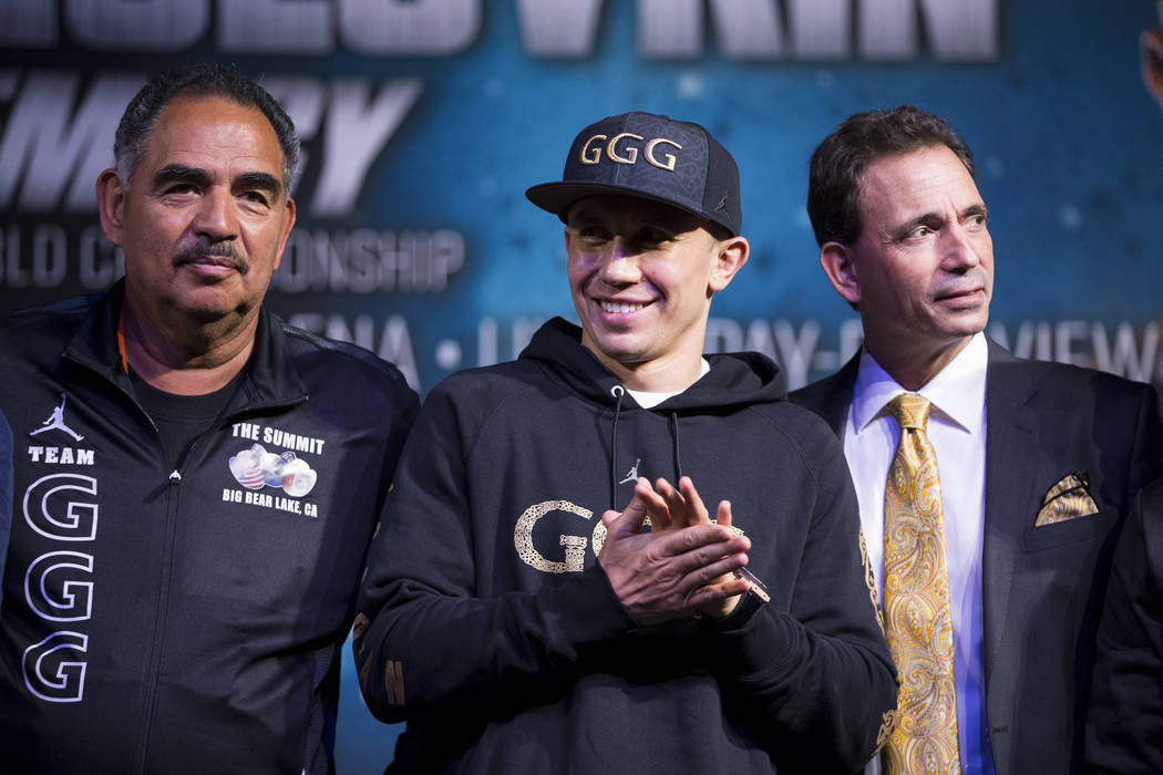 Gennady Golovkin, center, with his trainer Abel Sanchez, left, and his promoter Tom Loeffler, during a press conference at MGM Grand hotel-casino in Las Vegas, Wednesday, Sept. 13, 2017. Golovkin  ...