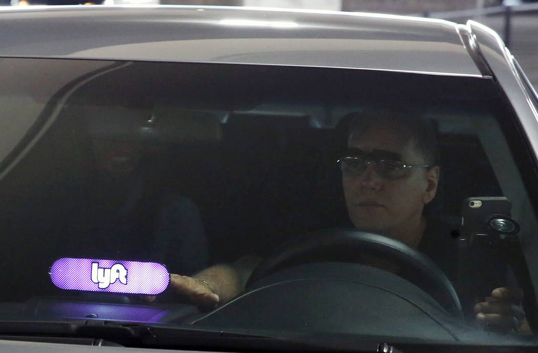 A driver displaying Lyft sign on his dashboard picks up his passenger from McCarran International Airport at Terminal 1 on Thursday, June 1, 2017, in Las Vegas. (Bizuayehu Tesfaye/Las Vegas Review ...