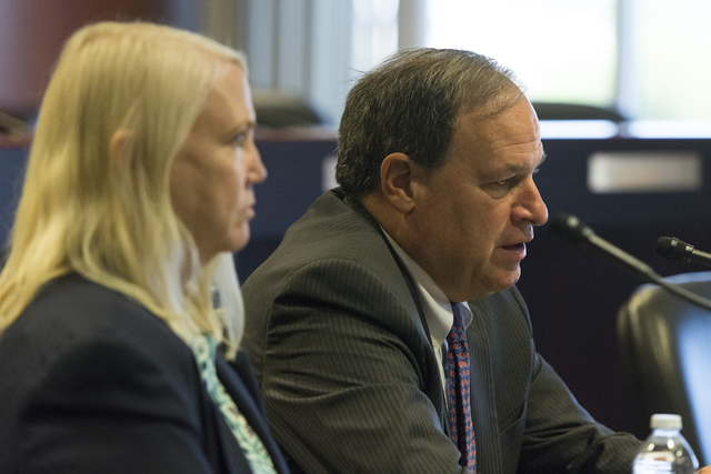 Nevada Treasurer Dan Schwartz, right, speaks during a public meeting on payday loans at the Sawyer Building in Las Vegas, Wednesday, Aug. 10, 2016. Nevada Deputy Treasurer Sheila Salehian looks on ...