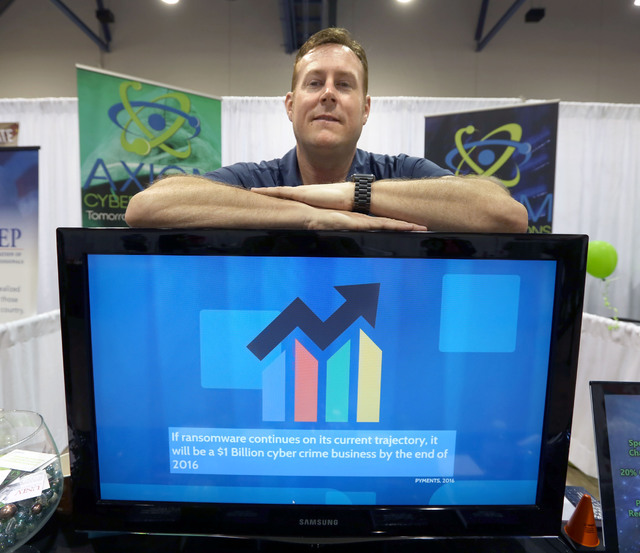 Axiom Cyber Solutions CEO Troy Wilkinson stands for a photo during the Business Expo sponsored by Las Vegas Metro Chamber at Cashman Field on Wednesday, June 15, 2016.  Jeff Scheid/Las Vegas Revie ...
