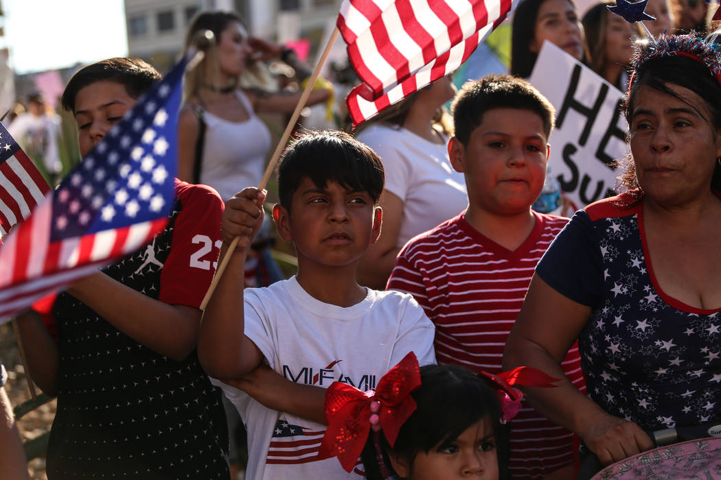 Several hundred DACA recipients and supporters including Angel Meneses, 9,  march down the Strip in Las Vegas, Sunday, Sept. 10, 2017, to call on President Donald Trump and Nevada elected official ...