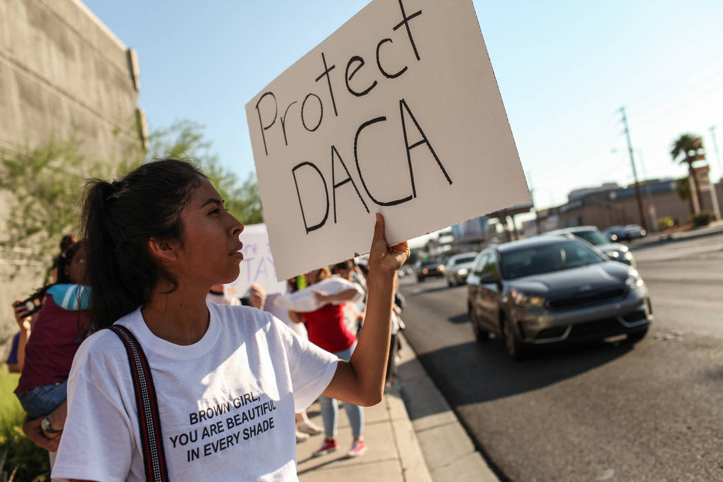 Several hundred DACA recipients and supporters including Itzel Gallegos march down the Strip in Las Vegas, Sunday, Sept. 10, 2017, to call on President Donald Trump and Nevada elected officials to ...