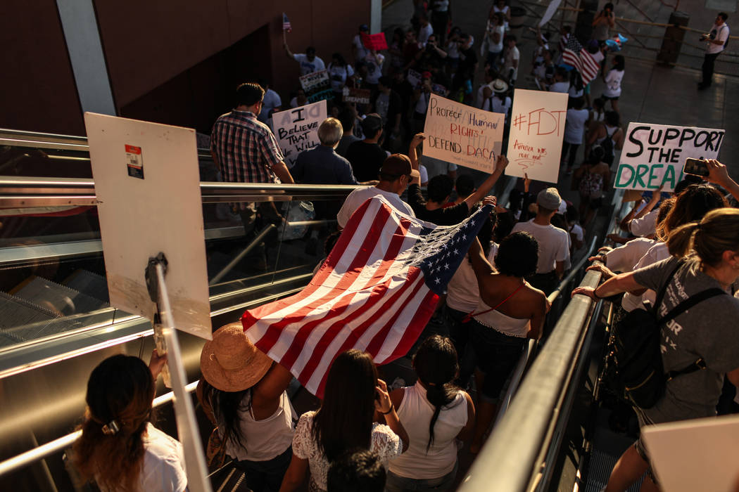 Several hundred DACA recipients and supporters march down the Strip in Las Vegas, Sunday, Sept. 10, 2017, to call on President Donald Trump and Nevada elected officials to protect the Obama-era in ...