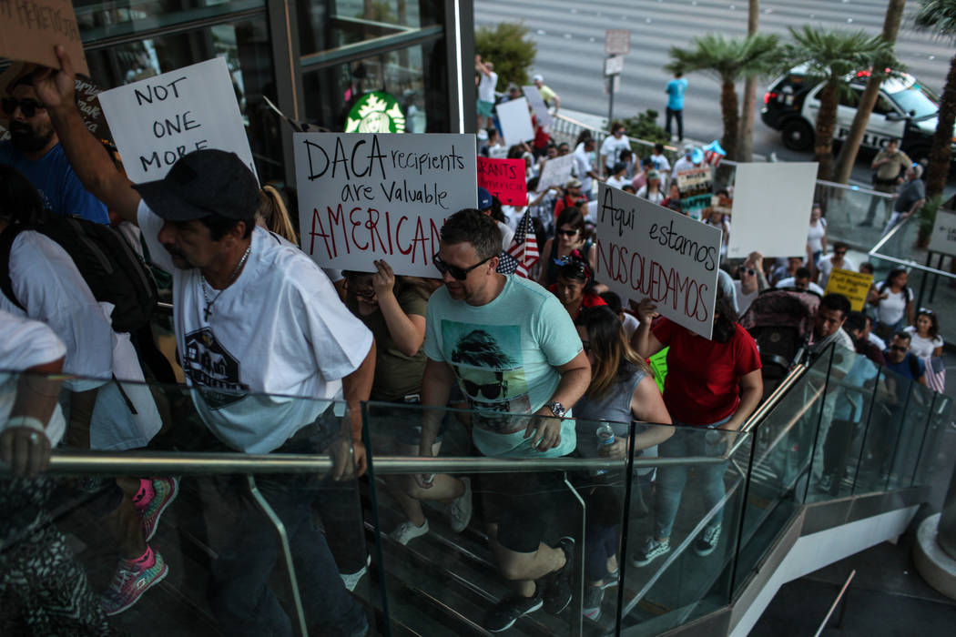 Several hundred DACA recipients and supporters march down the Strip in Las Vegas, Sunday, Sept. 10, 2017, to call on President Donald Trump and Nevada elected officials to protect the Obama-era in ...
