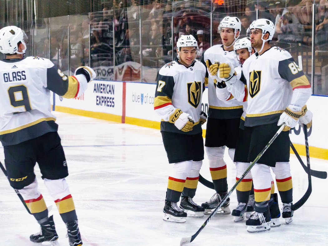 Golden Knights teammates wait to congratulate Cody Glass (9) after he scored in the first period of a rookies' hockey game against Los Angles Kings in El Segundo, Calf., Wednesday, Sept. 13, 2017. ...