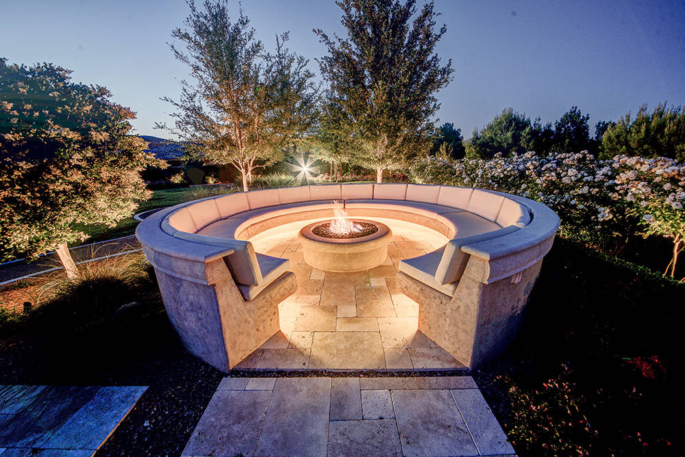This large seating area around a fire pit is in the private park. (The Napoli Group)