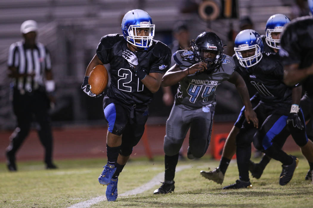 Basic's Dorian Ivan McAllister (21) runs the ball against Canyon Springs during the second quarter of a football game at Basic High School in Henderson, Friday, Sept. 15, 2017. Joel Angel Juarez L ...