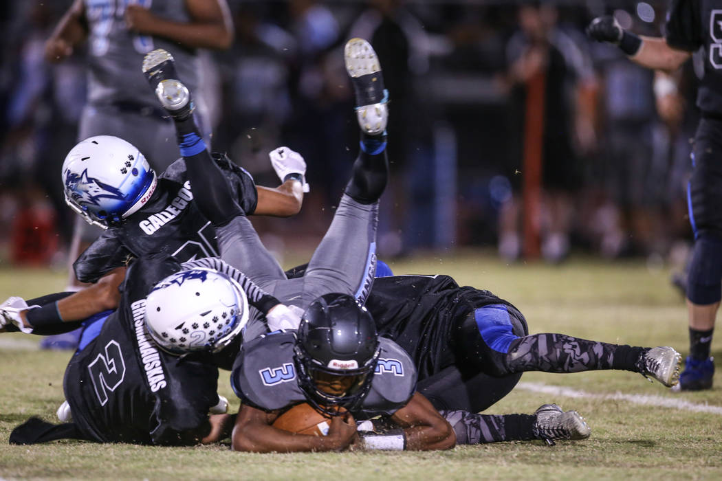 Canyon Springs' Jayvion Pugh (3) is tackled by Basic during the second quarter of a football game at Basic High School in Henderson, Friday, Sept. 15, 2017. Joel Angel Juarez Las Vegas Review-Jour ...