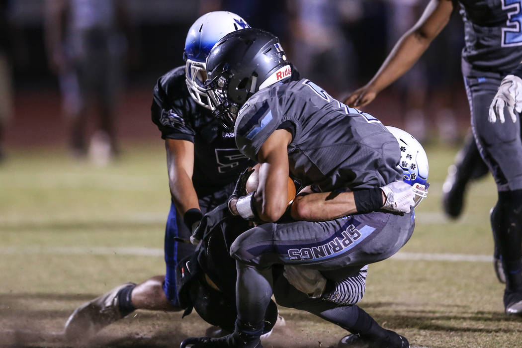 Basic's Zack Grismanauskas (2) is tackled by Canyon Springs during the second quarter of a football game at Basic High School in Henderson, Friday, Sept. 15, 2017. Joel Angel Juarez Las Vegas Revi ...