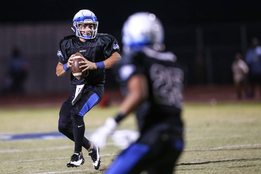 Basic's Paul Myro IV (3) prepares to throw a pass against Canyon Springs during the second quarter of a football game at Basic High School in Henderson, Friday, Sept. 15, 2017. Joel Angel Juarez L ...