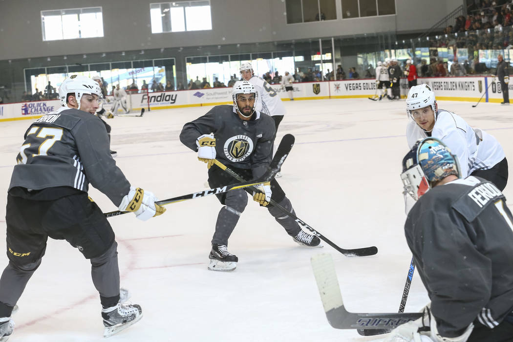 Vegas Golden Knights' David Perron, from left, Pierre-Edouard Bellemare, Luca Sbisa and Dylan Ferguson take part in a drill during the NHL team's practice at the City National Arena in Las Vegas,  ...