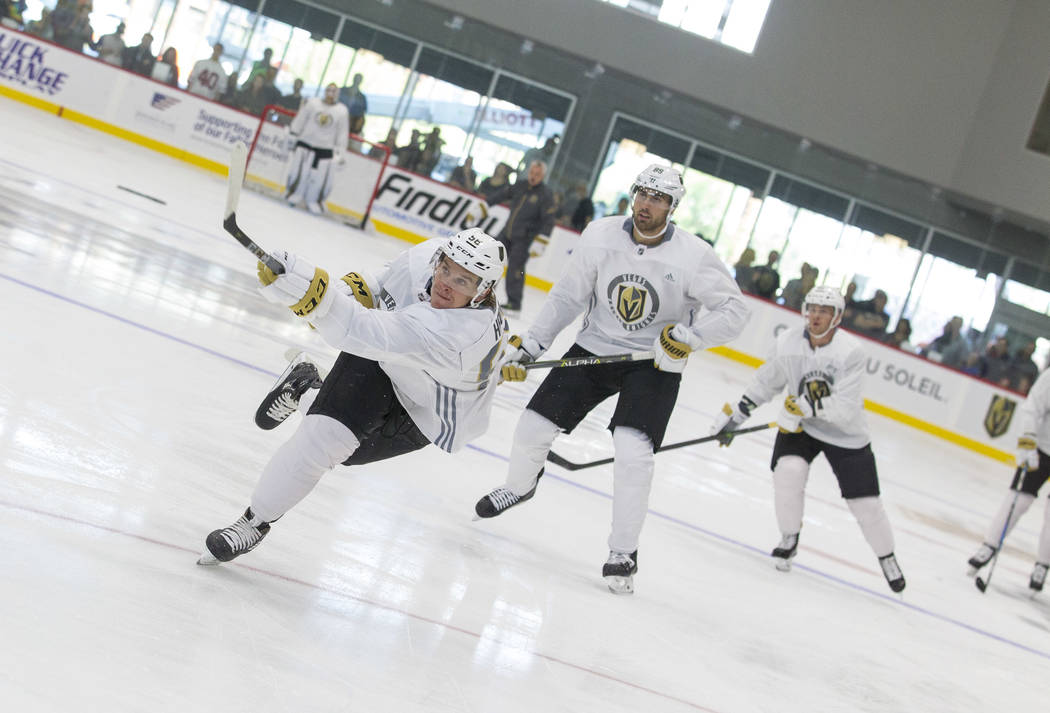 Vegas Golden Knights left wing Erik Haula, left, (56) takes a slapshot in a scrimmage game during the NHL team's practice at the City National Arena in Las Vegas, Saturday, Sept. 16, 2017. Richard ...