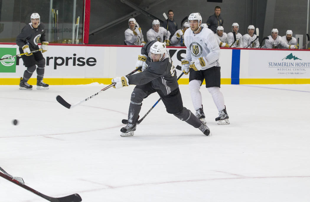 Vegas Golden Knights left wing Tomas Nosek, center, (92) takes a slapshot in a scrimmage game during the NHL team's practice at the City National Arena in Las Vegas, Saturday, Sept. 16, 2017. Rich ...