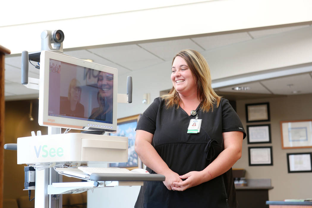 ER manager Case Lamp speaks with staff from Carson City Rural Clinics while demonstrating the new Telehealth technology during the Nevada Hospital Association's and the technology company Switch's ...