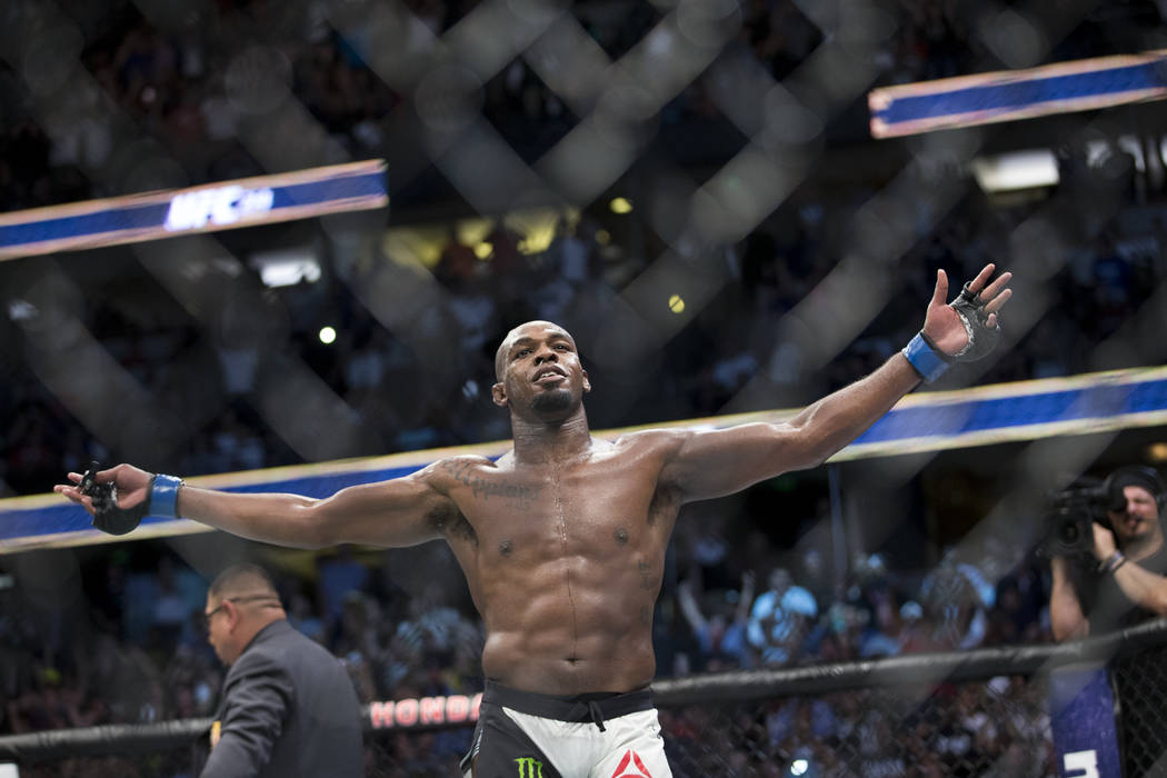 Jon Jones celebrates his win against Daniel Cormier in the light heavyweight title bout during UFC 214 at the Honda Center in Anaheim, Calif., on Saturday, July 29, 2017. Jones won by knockout. Er ...
