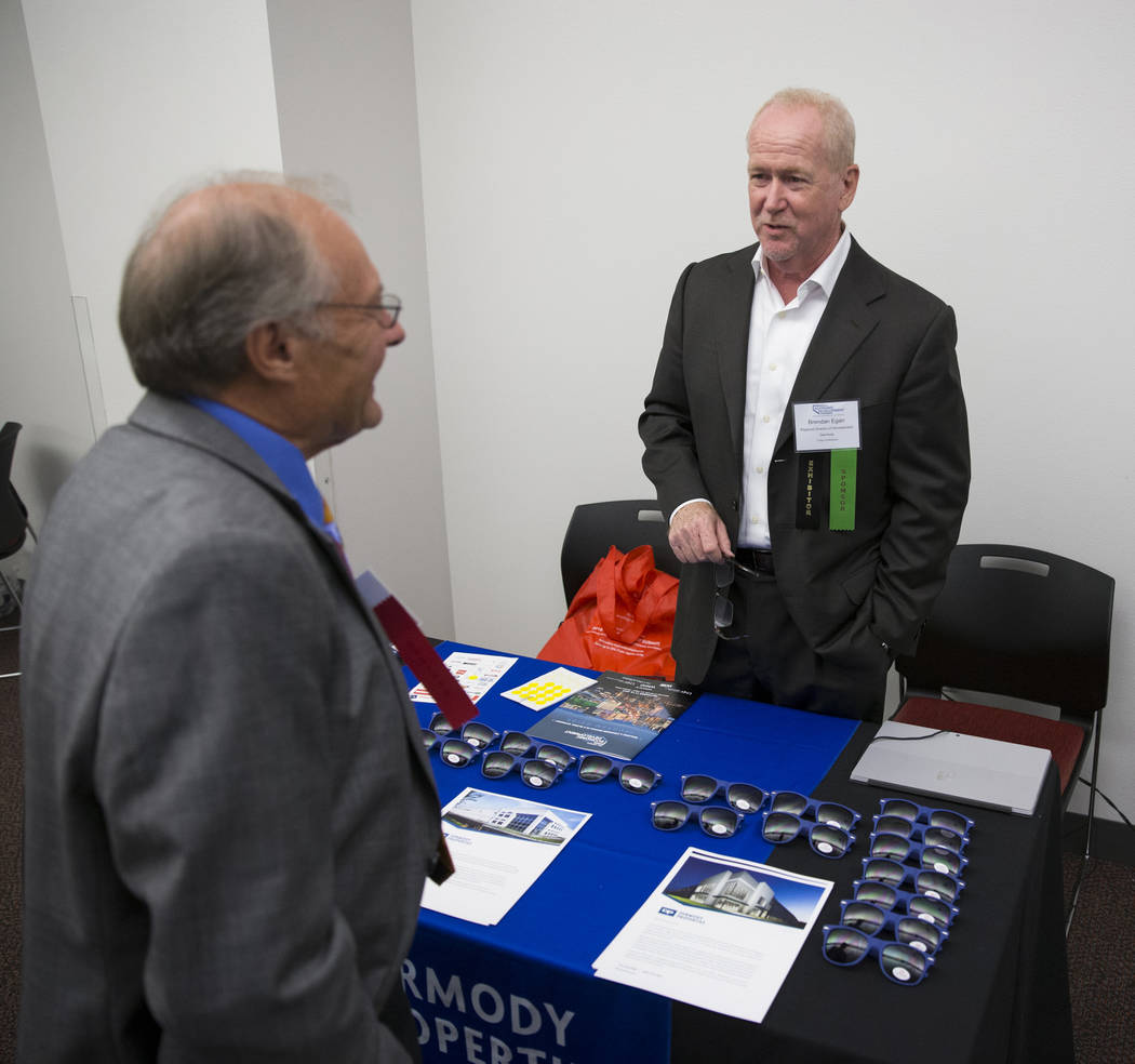 Clint Koble, left, speaks with exhibitor Brendan Egan, regional director of development for Dermody, during the Nevada Economic Development Conference in Las Vegas, Tuesday, Sept. 12, 2017. Erik V ...