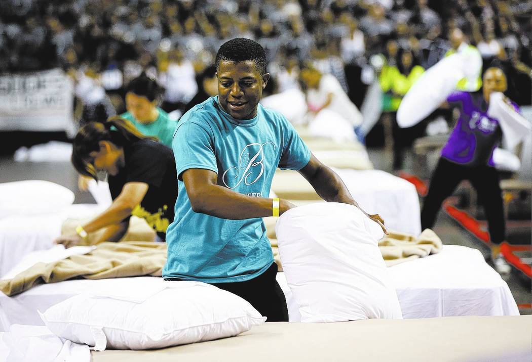 Bobby Henderson of the Bellagio competes in the bed making event during the Housekeeping Olympics at the Mandalay Bay Events Center in Las Vegas on Wednesday, Sept. 13, 2017. The competition drew  ...