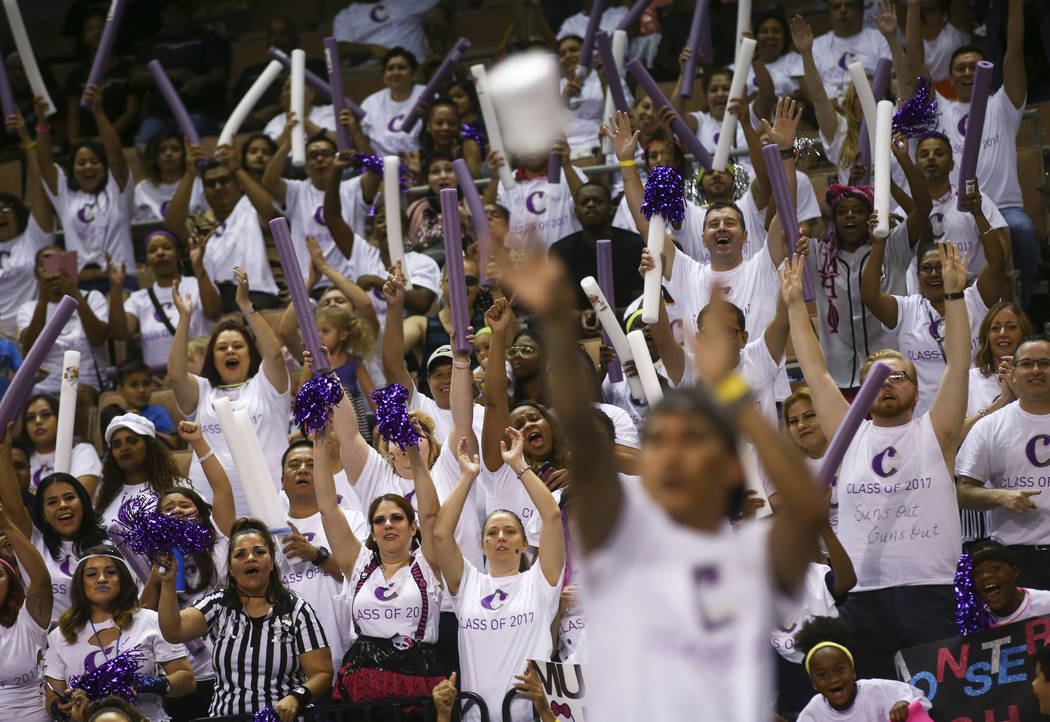 Employees of the Cosmopolitan of Las Vegas watch as Mark Icuspit competes in the toilet paper toss competition as part of the Housekeeping Olympics at the Mandalay Bay Events Center in Las Vegas o ...