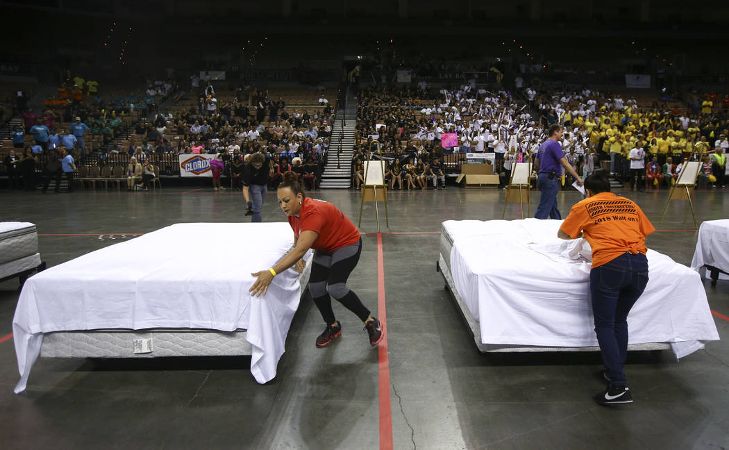 Alba Colon, left, of Red Rock Resort, and Josefina Moreno of Monte Carlo compete in the bed-making event during the Housekeeping Olympics at the Mandalay Bay Events Center in Las Vegas on Wednesda ...