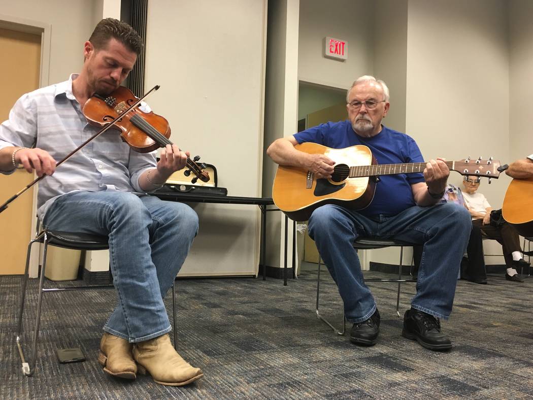 JD Jones (right) sets the beat for the next song the group is about to play while Odie Parkins, a self-described "newbie" to NOFA begins to play a tune. (Diego Mendoza-Moyers/View) @dmendozamoyers