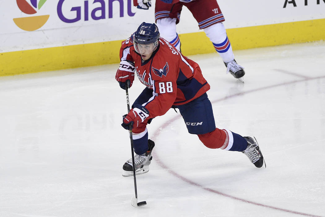 Washington Capitals defenseman Nate Schmidt (88) skates with the puck during the third period of an NHL hockey game against the New York Rangers, Wednesday, April 5, 2017, in Washington. The Capit ...