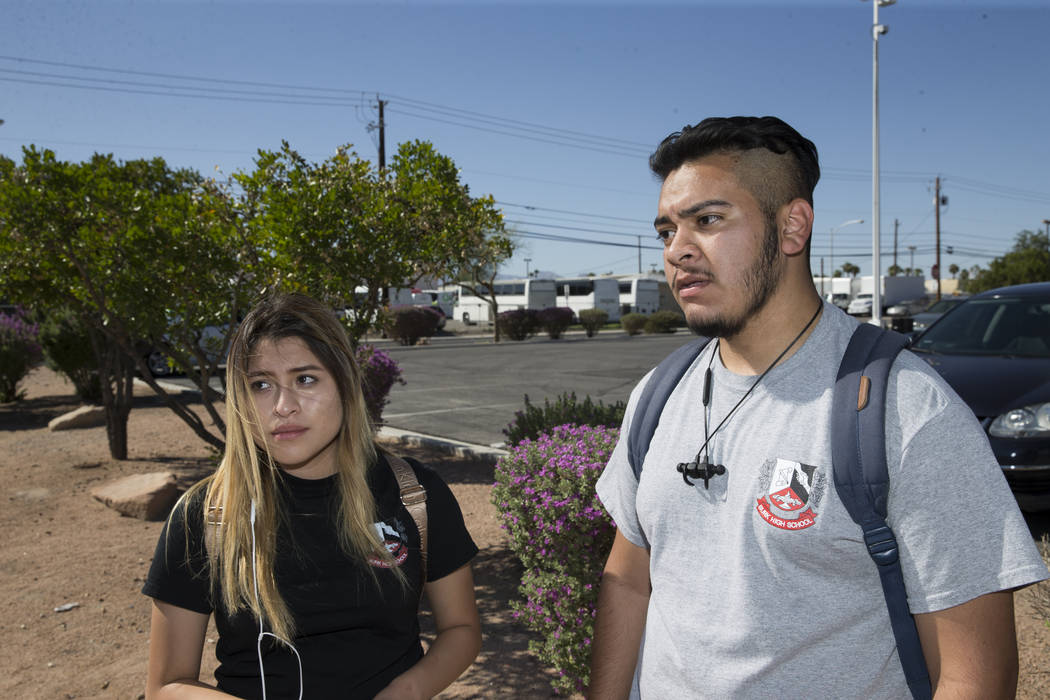 Esmeralda Toral, 17, left, and Anthony Ramirez, 17, students concerned about budget cuts at Burk Horizon High School, are interviewed outside of their school in Las Vegas, Wednesday, Sept. 20, 201 ...