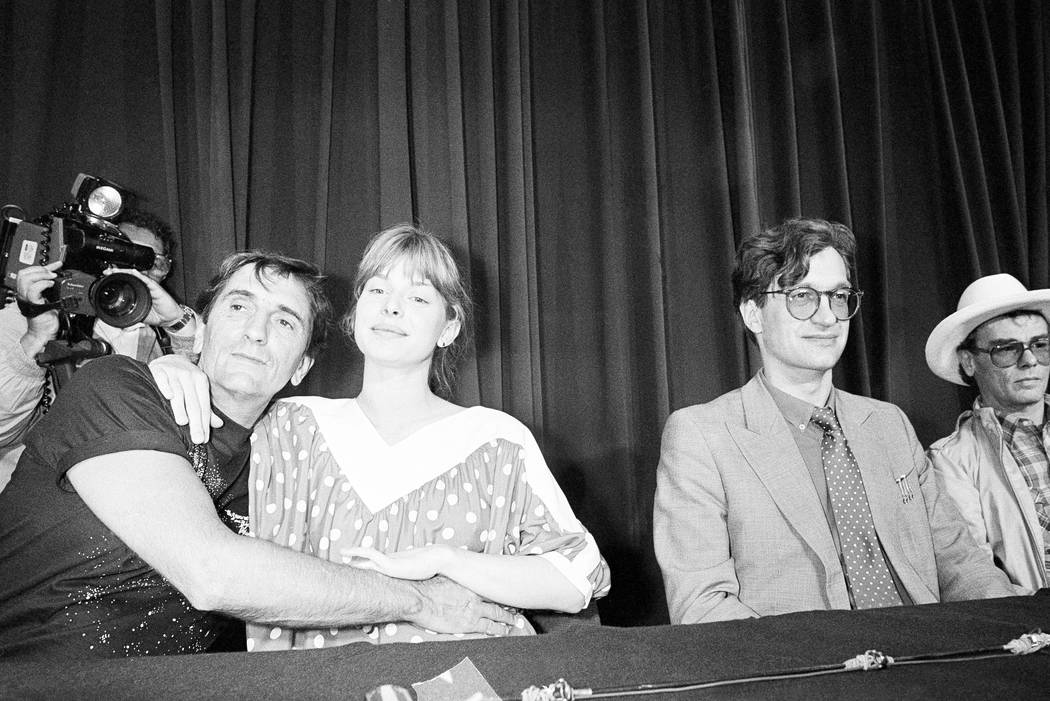 Harry Dean Stanton, left, and German actress, Nastassja Kinski embrace during a photo session at the 37th Cannes Film Festival in 1984. (AP Photo/Michel Lipchitz, File)