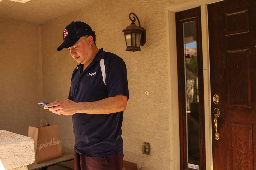 Rick Lewis, a driver for same-day delivery service Dropoff, delivers a package from Sprinkles located in The Linq Hotel Monday, Sept. 18, 2017 in Las Vegas. The Dropoff platform, both an app and a ...